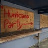 'Hurricane Party' written on plywood covering the window of the Lager Heads Tavern in Wrightsville Beach, North Carolina, Tuesday