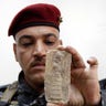 Policeman Holding Artifact