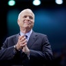 U.S. Republican presidential nominee Senator John McCain listens as he is introduced at a campaign rally in 2008