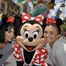 In this April 25, 2009 photo provided by Disney, singer-songwriter Katy Perry, left, and actress Hayden Panettiere, right, pose for a  picture with Minnie Mouse at Disney's Hollywood Studios in Lake Buena Vista, Fla.  The duo was enjoying the theme park prior to their evening performance for Disney's Grad Nite, an annual, in-park concert for high school seniors. Panettiere stars on the hit NBC series 