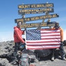 Jake Rath, left, of the Steven and Alexandra Cohen Foundation, and Marine Cpl. Kionte Storey at the summit of Mount Kilimanjaro.