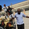 Libyan_Rebel_Running_in_street_with_gun