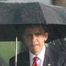 President Obama takes the stage in rain storm