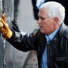 Vice President Mike Pence cleans a portion of the Vietnam Veterans Memorial on Veterans Day