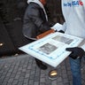 Volunteers remove mementos before cleaning the wall at the Vietnam Veterans Memorial on Veterans Day