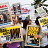 Activists protest President obama visit 