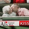 Former U.S. president George Bush and his wife Barbara Bush are seen kissing on a giant electronic screen
