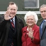 George W. Bush waves alongside his parents, former President George Bush and former first lady Barbara Bush 