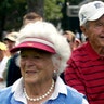 Former President George H.W. Bush and his wife Barbara watch the the AT&T National PGA golf tournament