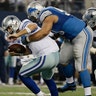 Detroit Lions defensive tackle Ndamukong Suh (90) sacks Dallas Cowboys quarterback Tony Romo (9)