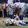 Dallas Cowboys quarterback Tony Romo (9) celebrates a touchdown against the Detroit Lions