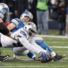 Dallas Cowboys defensive end Demarcus Lawrence recovers the ball after sacking Detroit Lions quarterback Matthew Stafford causing a fumble