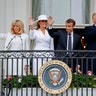 President Donald Trump, first lady Melania Trump, French President Emmanuel Macron and his wife stand on the Truman Balcony