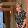 South African President Nelson Mandela shows the way to Princess Diana during a meeting in Cape Town, March 17, 1997