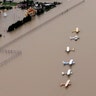 Airplanes sit at a flooded airport near the Addicks Reservoir as floodwaters from Tropical Storm Harvey rise Tuesday, in Houston