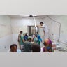 Afghan medical personnel tend to a wounded person