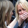 A woman reacts as police evacuate the Arndale shopping centre, in Manchester, England hours after the Manchester terror attack.