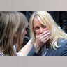 A woman reacts as police evacuate the Arndale shopping centre, in Manchester, England hours after the Manchester terror attack.