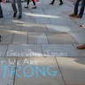 A message is written on the pavement in Manchester, England, Tuesday May 23, 2017