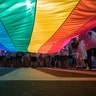 Marchers unfurl a huge rainbow flag as they prepare to march in the Equality March for Unity and Pride in Washington