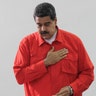 President Nicolas Maduro gestures after he casts his ballot as he votes for a constitutional assembly in Caracas, Venezuela