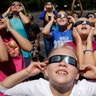 Fourth graders at Clardy Elementary School in Kansas City, Mo. practice the proper use of their eclipse glasses, August 18