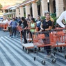 Eduardo Soriano of Miami, waits in a line since dawn to purchase plywood sheets at a Home Depot store in North Miami, Fla., Wednesday