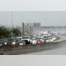 Northbound traffic on the turnpike backs up in the rain as motorist prepare for Hurricane Irma in Sunrise, Fla., Thursday