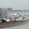 Northbound traffic on the turnpike backs up in the rain as motorist prepare for Hurricane Irma in Sunrise, Fla., Thursday