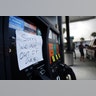 A note is posted on a gas pump after the station ran out of gas ahead of Hurricane Irma in Daytona Beach, Fla., Friday