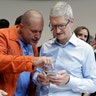 Apple CEO Tim Cook and Jonathan Ive, Chief Design Officer show the new iPhone X in the showroom Tuesday, in Cupertino