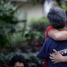 Men hug, crying with joy, as they reunite hours after an earthquake in the Condesa neighborhood of Mexico City, Tuesday