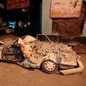 A car stands crushed by rubble after a 7.1 earthquake, in Jojutla, Morelos state, Mexico, Tuesday