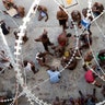 Prisoners play dominoes, checkers or card games, during recreation time inside the National Penitentiary in downtown Port-au-Prince, Haiti.