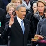 U.S. President Barack Obama recites his oath of office for the second time, on Jan. 21, 2013, as first lady Michelle Obama looks on during swearing-in ceremonies on the West front of the U.S Capitol in Washington.