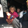 IDPs are loaded into a truck after a midnight escape from ISIS in Badush, Iraq, April 2017