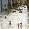 People walk through flooded streets in Havana after the passage of Hurricane Irma in Cuba, September 10, 2017