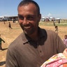 An Iraqi shepherd cares for a baby that was the product of ISIS raping and torturing the white mother, April 2017