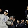 Girardi and Matsui hold trophies