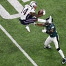 New England Patriots Brandin Cooks attempts to hurdle Philadelphia Eagles Rodney McLeod in the first half in Super Bowl 52 in Minneapolis