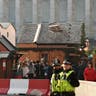 Police patrol German-style Christmas market in Birmingham, England, Tuesday. Police are reviewing security measures and increasing visible patrols following the attack in Berlin.