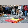 People gather around a memorial in Brussels following bomb attacks in Brussels, Belgium, March 22, 2016. 