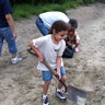 Renee_Scorcia_helps_her_Howards_beach_family_fill_sandbags