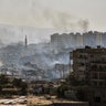 Smoke rises in an east Aleppo neighborhood in Syria, Thursday, Dec. 15, 2016, in this photo released by the Syrian official news agency SANA.