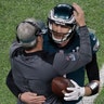 Philadelphia Eagles quarterback Nick Foles celebrates with Eagles head coach Doug Pederson after scoring a touchdown in Super Bowl 52