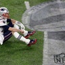 New England Patriots quarterback Tom Brady sits on the field after a fourth quarter fumble against the Philadelphia Eagles in Super Bowl 52