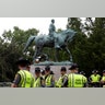 Virginia State Troopers stand under a statue of Robert E. Lee before a white supremacists rally in Charlottesville, Virginia, August 12  