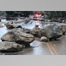 Boulders block a road after a mudslide in Montecito, California, January 9, 2018