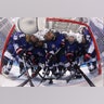 Players from the United States gather around the goal before their women's hockey game against the team from Russia in Pyeongchang