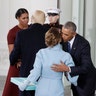 President Barack Obama greets Melania Trump as first lady Michelle Obama greets President-elect Donald Trump at the White House in Washington. 
